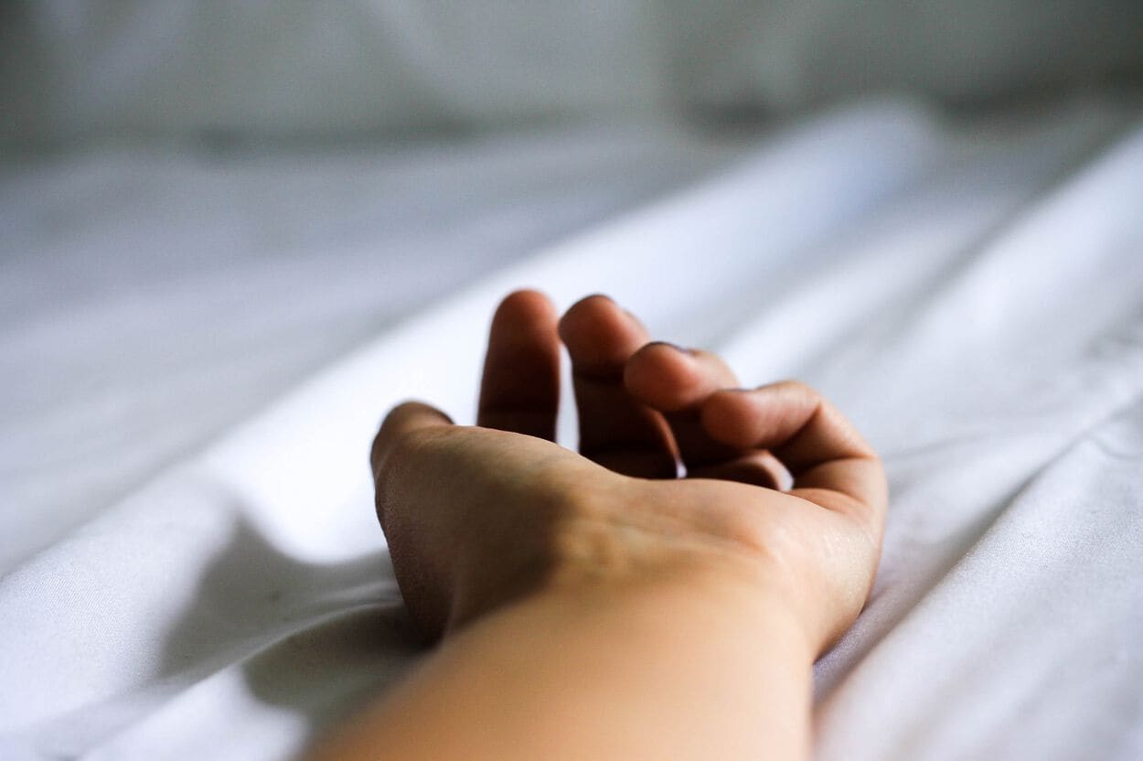 Hand in bed